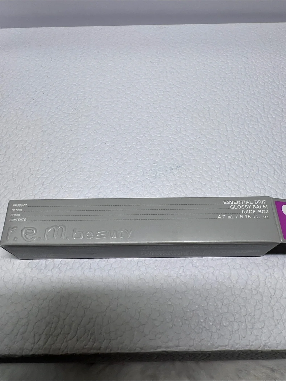 R.E.M. Beauty Essential Drip Glossy Balm in Juicebox